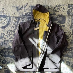 J Crew Navy rain jacket blue with yellow inside. Brand new with tags.